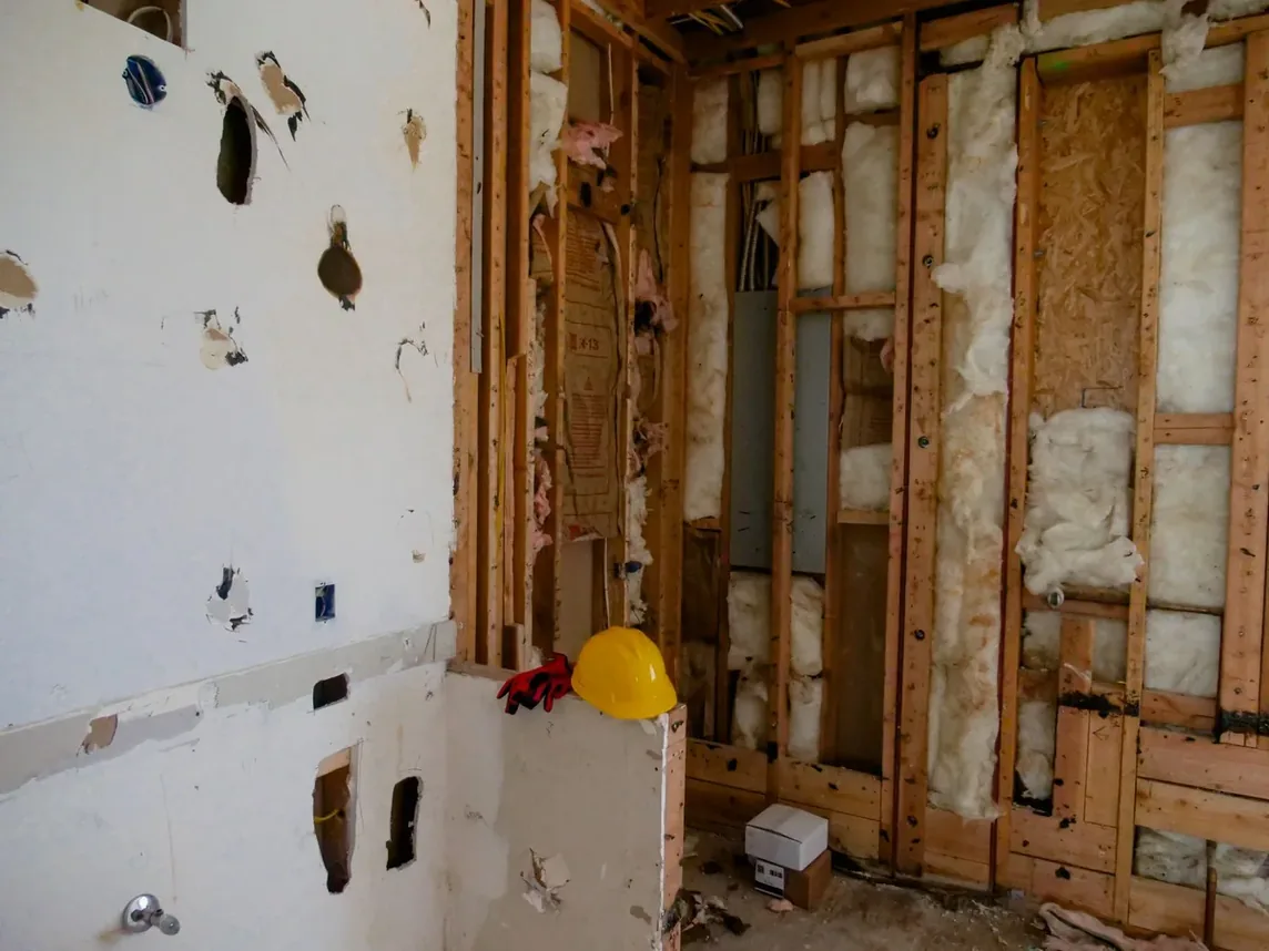 A room opened up to the wall studs and insulation partway through a renovation